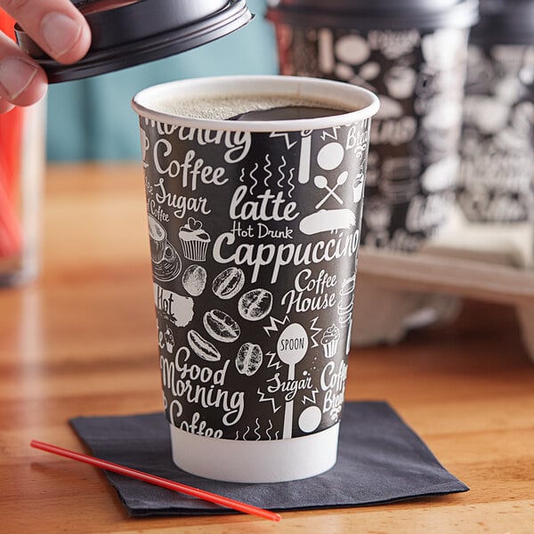 A person pouring coffee into a black and white Choice paper hot cup.
