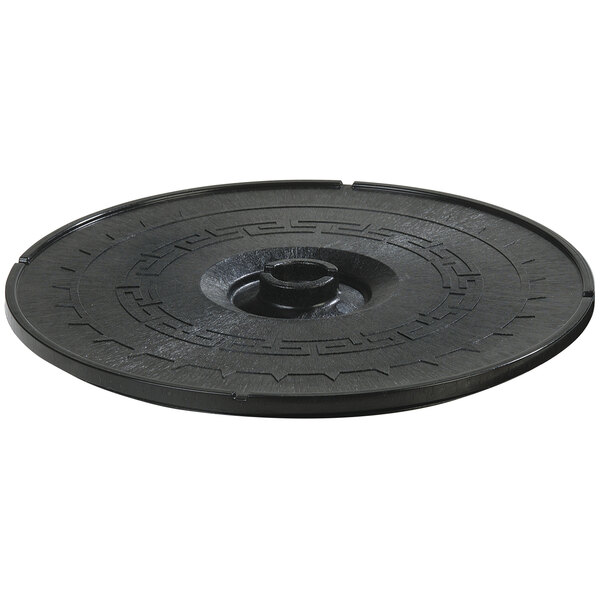 A black circular lid with a circular design.