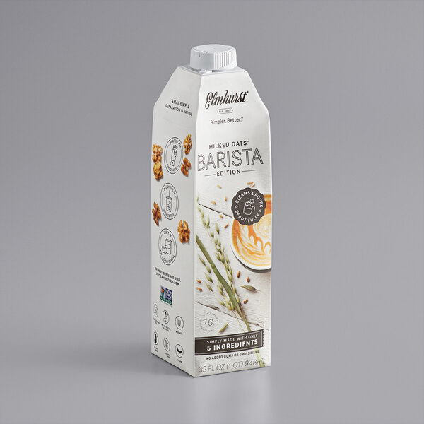 A white carton of Elmhurst Barista Oat Milk with a label.