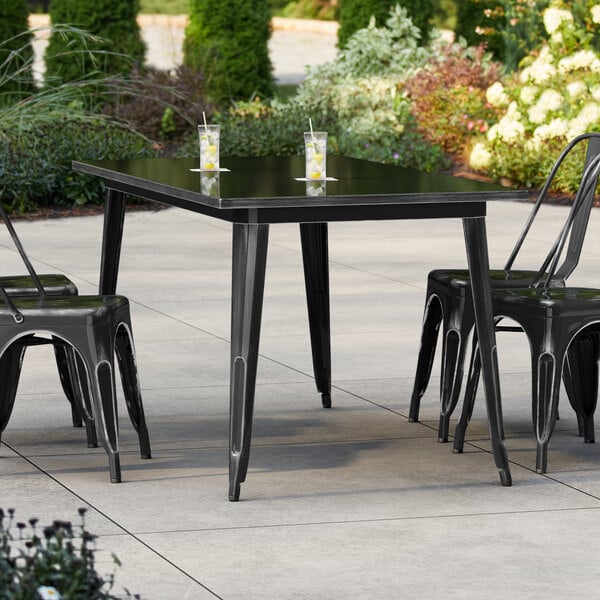 Lancaster Table & Seating Alloy Series 63" x 32" Distressed Onyx Black Standard Height Outdoor Table