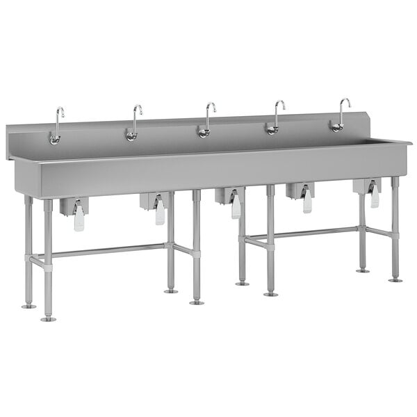 A large stainless steel Advance Tabco multi-station hand sink with knee valve faucets.