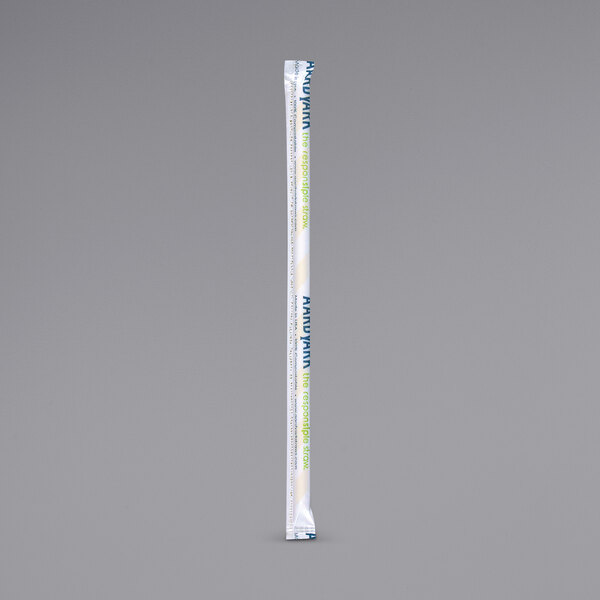 A white paper straw wrapped in yellow and white striped paper with blue and yellow text.