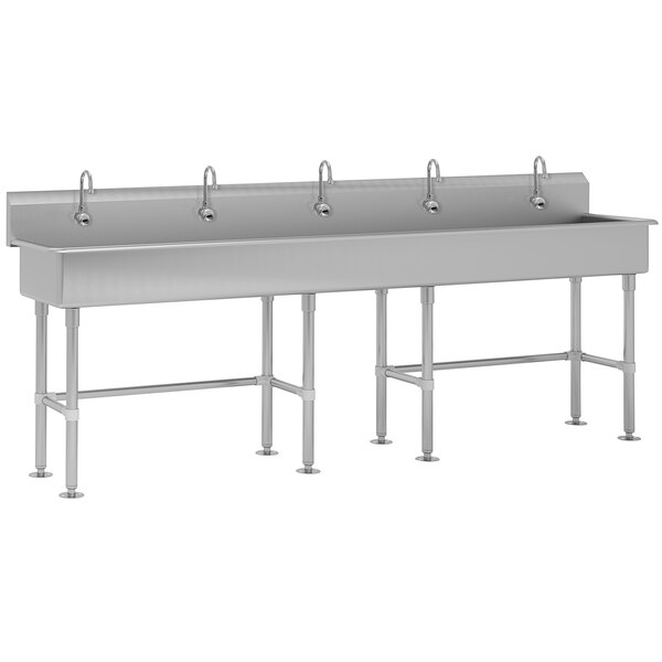 A large stainless steel Advance Tabco multi-station hand sink with faucets.