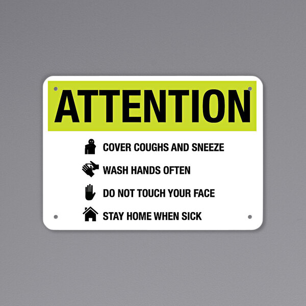 A black and yellow aluminum sign that says "Attention Cover Coughs And Sneeze" with symbols.