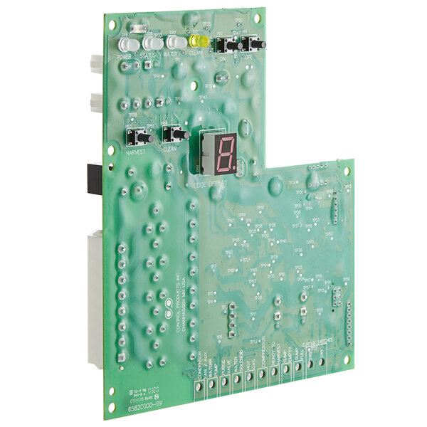 A green circuit board for a Scotsman ice cuber with a small circuit board.