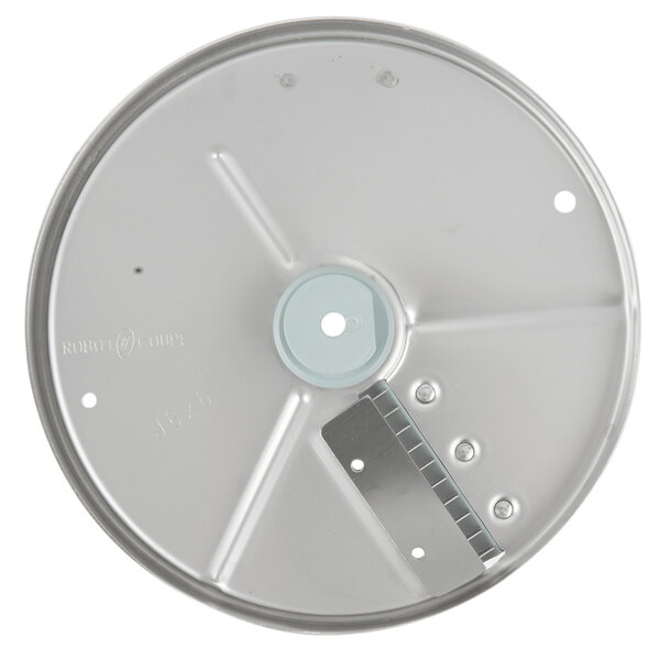 A circular metal Robot Coupe Julienne Cutting Disc with a hole in the center.