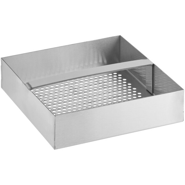 A stainless steel floor drain strainer with holes in it.