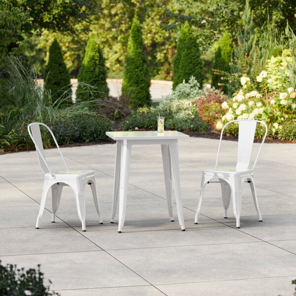 Lancaster Table & Seating Alloy Series 23 1/2" x 23 1/2" White Standard Height Outdoor Table with 2 Cafe Chairs