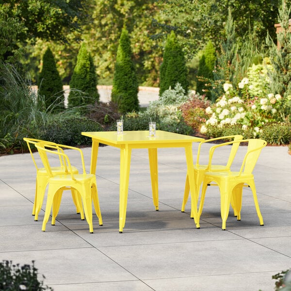 Lancaster Table & Seating Alloy Series 47 1/2" x 29 1/2" Citrine Yellow Standard Height Outdoor Table with 4 Arm Chairs