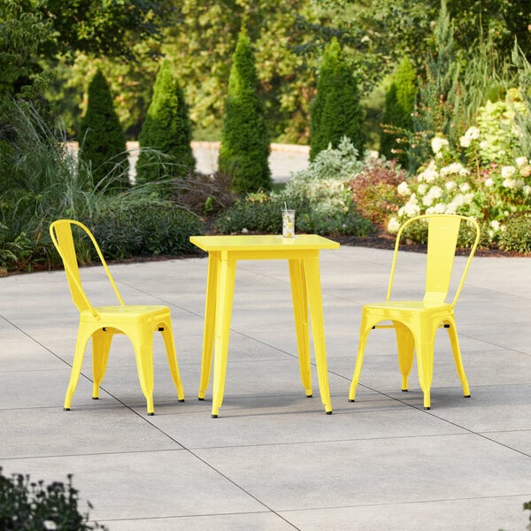 Lancaster Table & Seating Alloy Series 23 1/2" x 23 1/2" Yellow Standard Height Outdoor Table with 2 Cafe Chairs