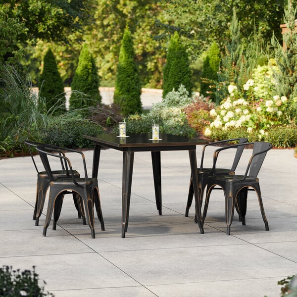 Lancaster Table & Seating Alloy Series 47 1/2" x 29 1/2" Distressed Copper Standard Height Outdoor Table with 4 Arm Chairs
