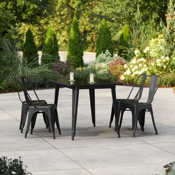 Lancaster Table & Seating Alloy Series 47 1/2" x 29 1/2" Black Standard Height Outdoor Table with 4 Cafe Chairs