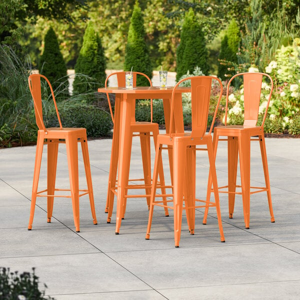 Lancaster Table & Seating Alloy Series 30" Round Amber Orange Bar Height Outdoor Table with 4 Cafe Barstools