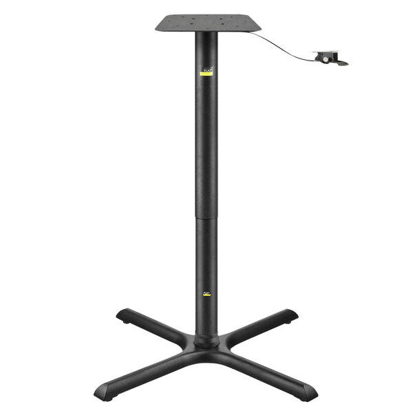 A FLAT Tech black table base with a metal post and cable.