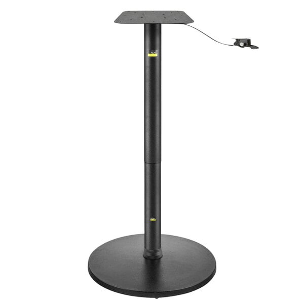 A FLAT Tech black table base with a black pole.