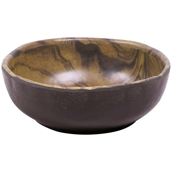 An Elite Global Solutions round melamine bowl with a black and brown wood grain surface.