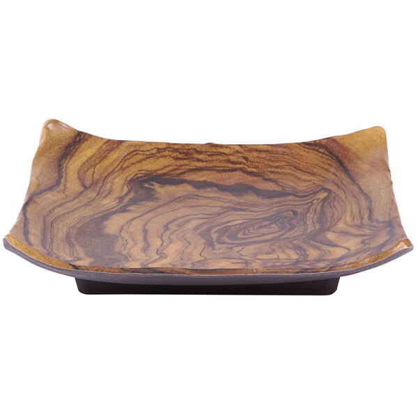 A brown square Elite Global Solutions wood grain melamine plate with a curved edge.