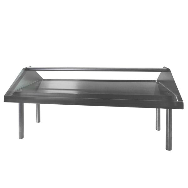 A stainless steel Advance Tabco double-sided slant rack shelf on a metal table.