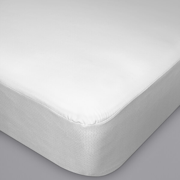 A white mattress with a Protect-A-Bed white mattress protector on it.
