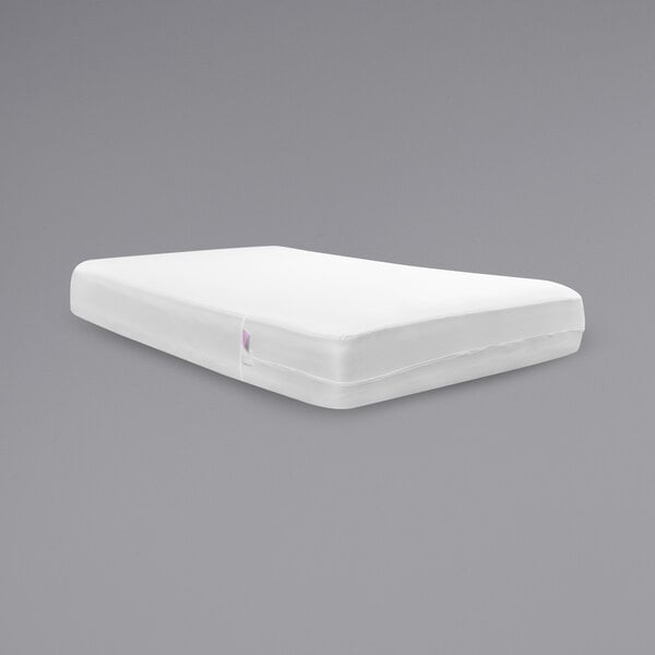 A white BedPure mattress encasement on a gray mattress.