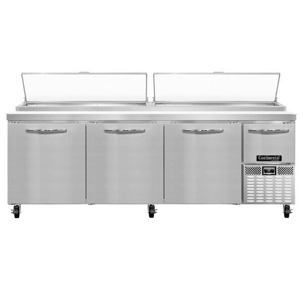 A Continental Refrigerator pizza prep table with 3 full doors and 1 half door.