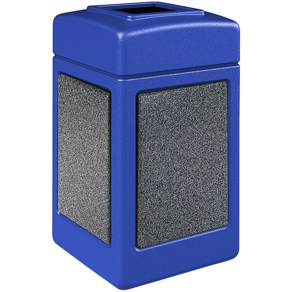 A blue rectangular Commercial Zone StoneTec waste receptacle with a square top and Pepperstone panels.