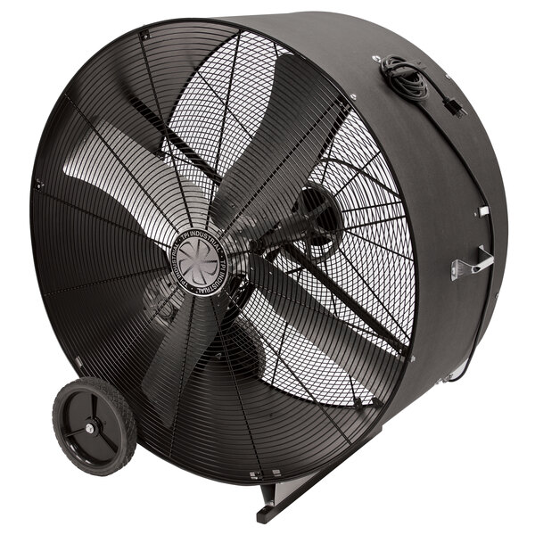 A black TPI industrial drum fan with wheels.