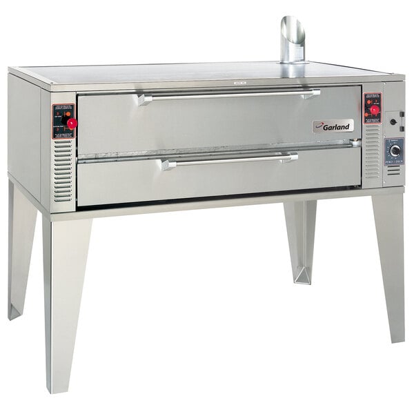 A large stainless steel Garland pizza deck oven.