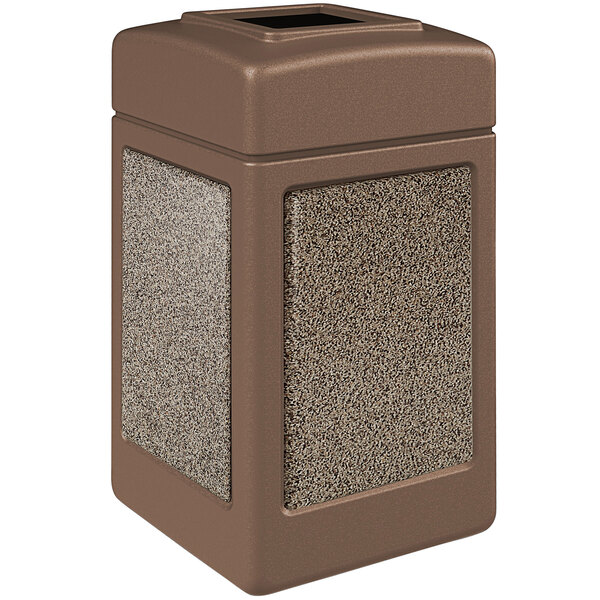 A brown rectangular Commercial Zone StoneTec waste receptacle with square top and riverstone panels.
