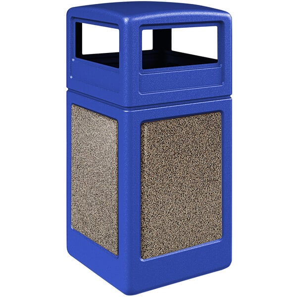 A blue rectangular Commercial Zone StoneTec trash can with brown and tan riverstone panels and dome lid.