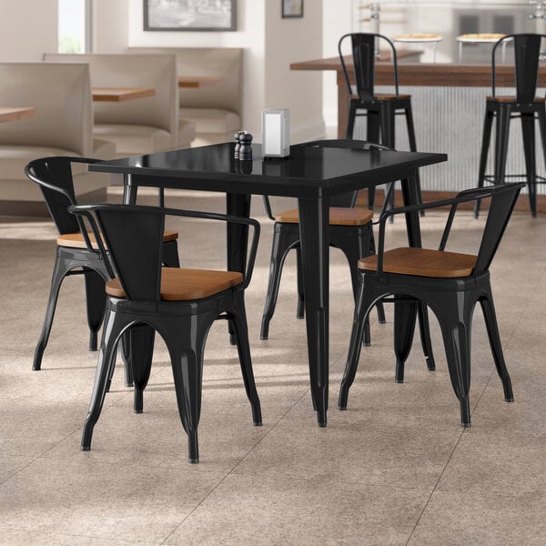 Lancaster Table & Seating Alloy Series 36" x 36" Onyx Black Standard Height Indoor Table and 4 Arm Chairs with Walnut Wood Seats