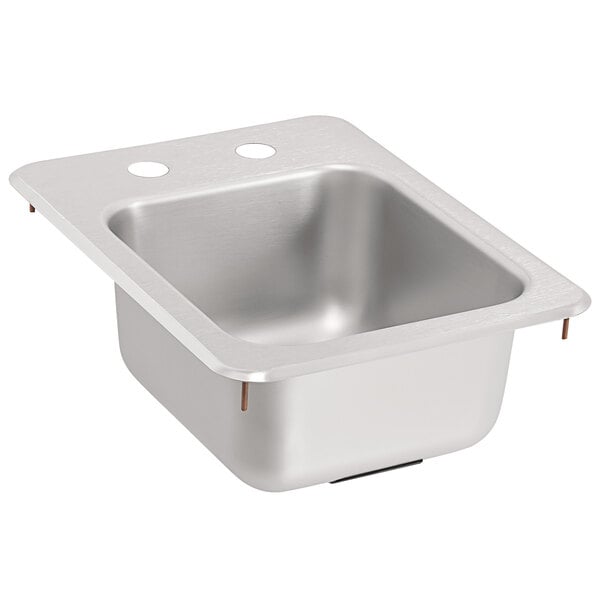 A stainless steel Vollrath sink bowl with two holes in the bottom.