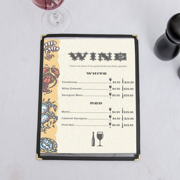 Menu paper with a seafood themed buffet design on a table with a glass of wine.