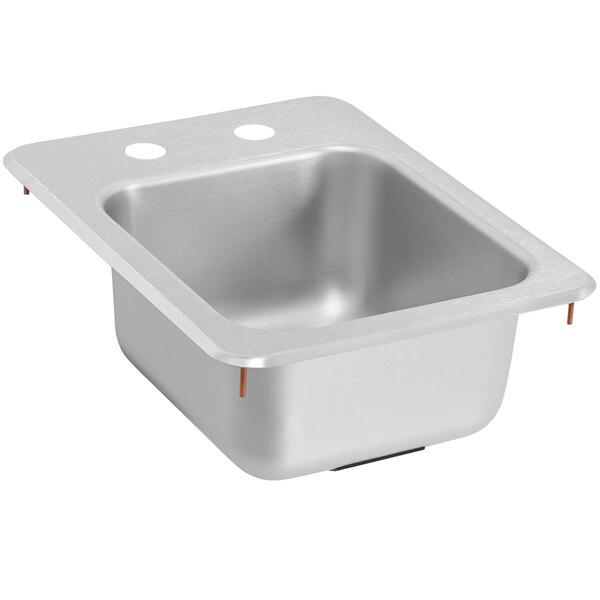 A silver stainless steel Vollrath sink with two holes in the bottom.