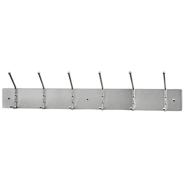 A satin aluminum Ex-Cell Kaiser wall mounted coat rack with 6 double hooks.