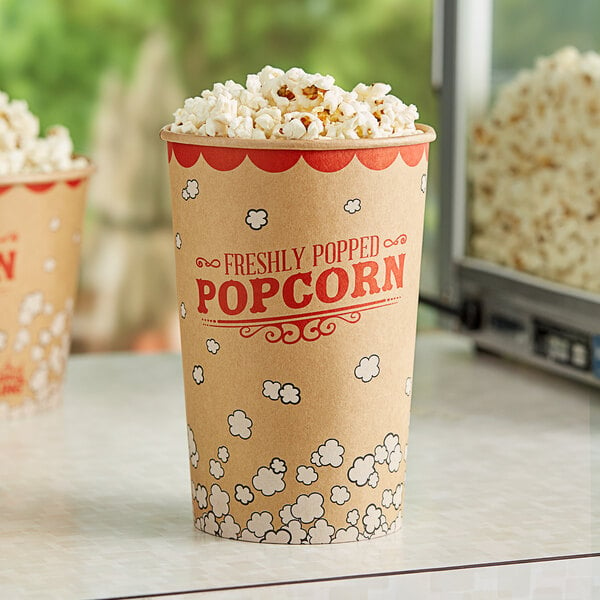 Two Carnival King paper popcorn buckets filled with popcorn.