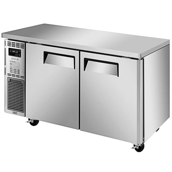 A stainless steel Turbo Air J Series undercounter freezer with two doors.