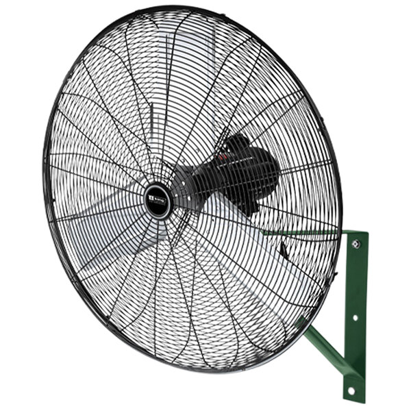 A black King Electric wall-mounted industrial fan with a green handle.