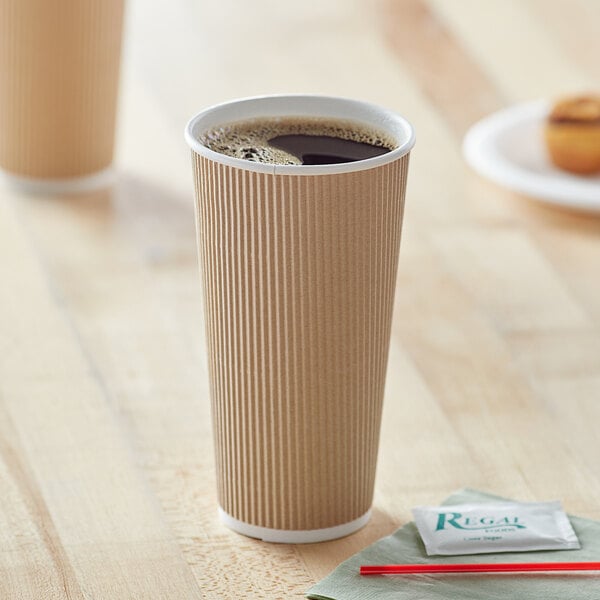 A close-up of a brown Choice double wall paper hot cup.