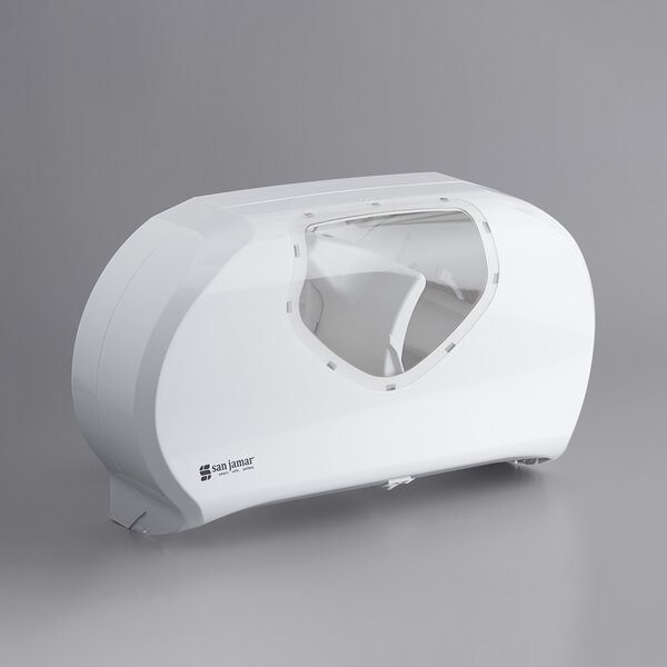 A white San Jamar toilet paper dispenser with a clear window.