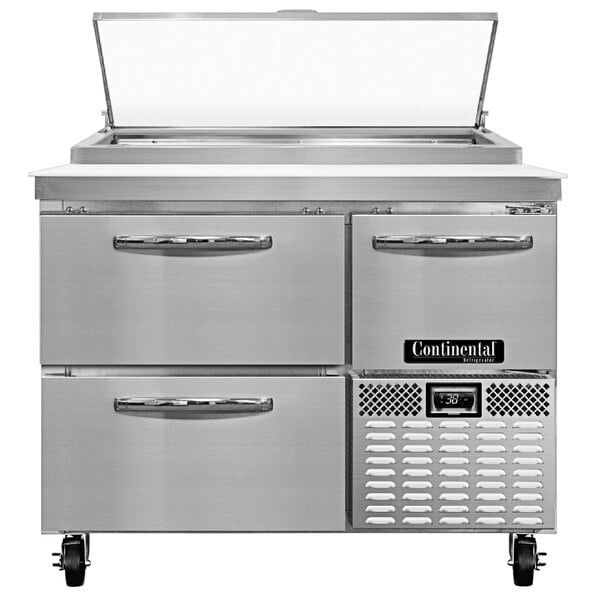 A stainless steel Continental Pizza Prep Table with two drawers and half door.