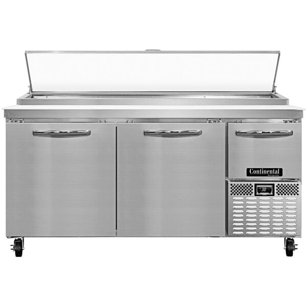 A stainless steel Continental Refrigerator pizza prep table with two full doors and one half door.