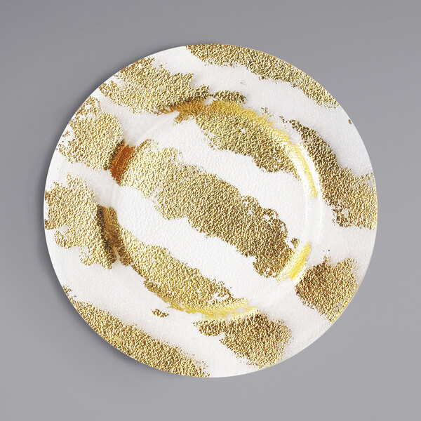 An American Atelier glass charger plate with a gold ribbon design on the rim.
