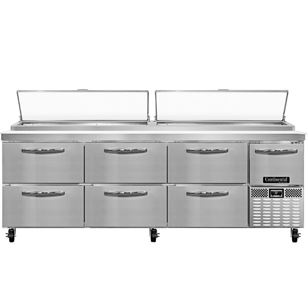 A stainless steel Continental Refrigerator pizza prep table with six drawers and a half door.