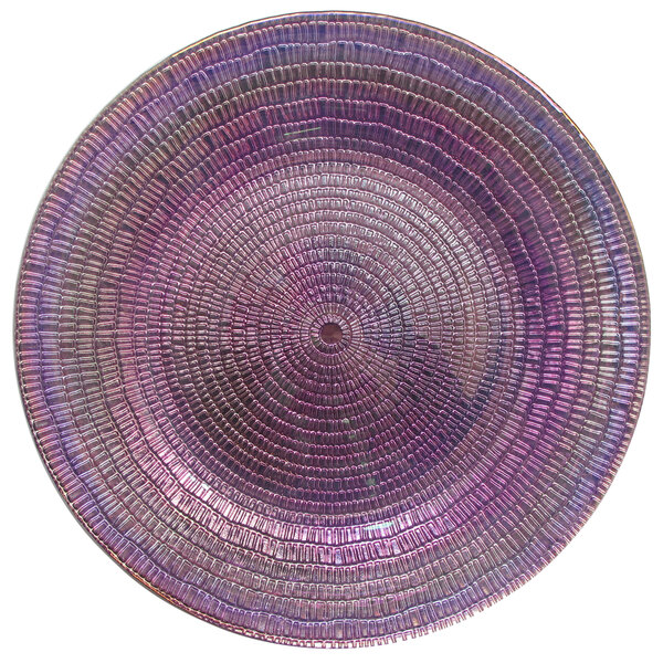 An American Atelier taffy luster glass charger plate with a circular design in purple and pink.