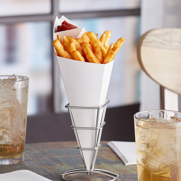 A Carnival King white cardboard fry cone filled with french fries on a table.