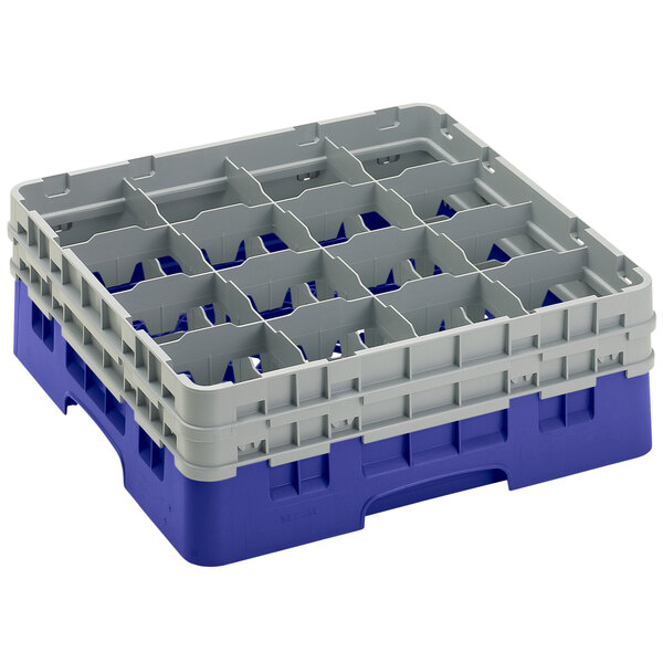 A navy blue plastic Cambro glass rack with 16 compartments.
