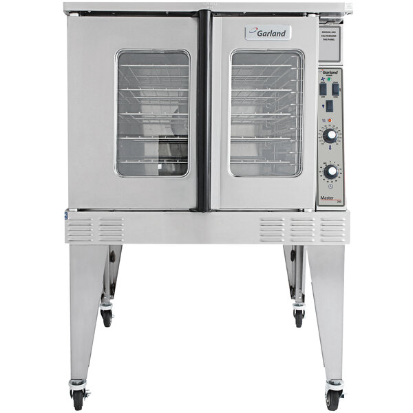 A white Garland commercial convection oven with glass doors on wheels.