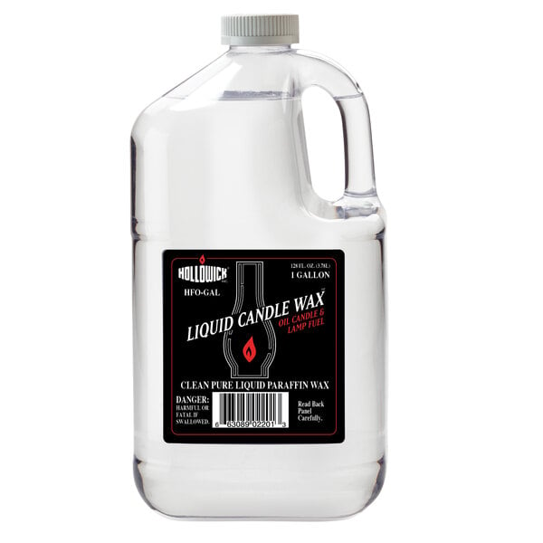 A clear jug of Hollowick liquid candle wax with a black label.