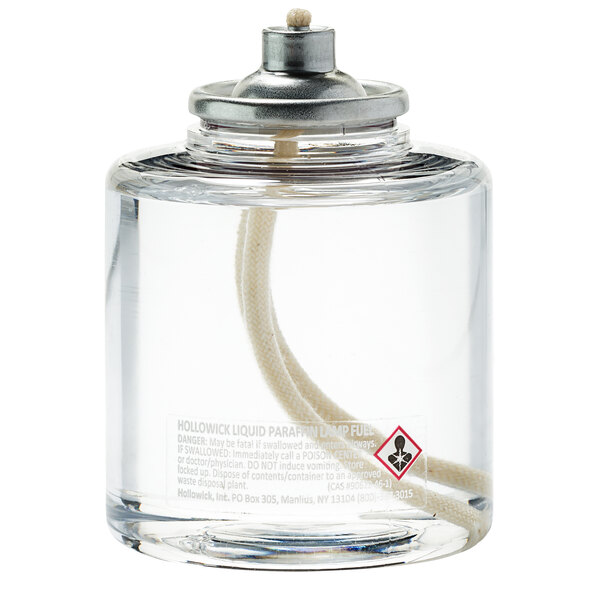 A clear container with a white label containing "Hollowick 36 Hour Clear Liquid Candle Fuel" 